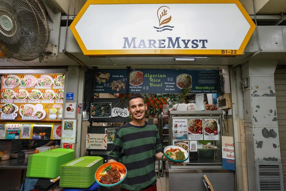 Mr Yahiaoui El-Hani serves North African dishes at his stall, MareMyst, at Golden Mile Food Centre.