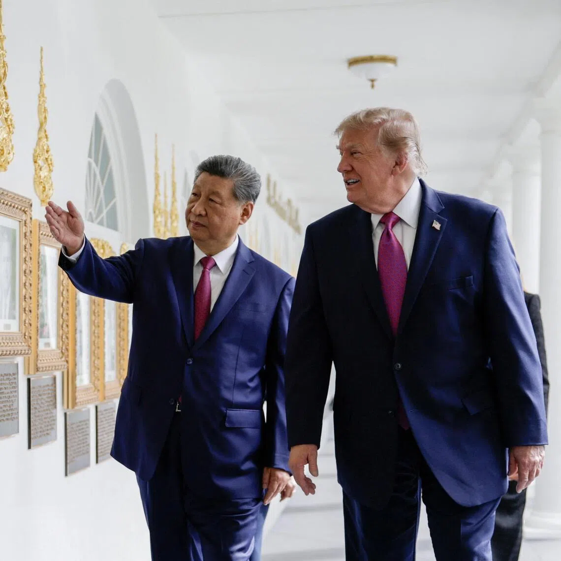 US President Donald Trump and Chinese President Xi Jinping looking at an image of an autopen signing former US president Joe Biden’s signature in the Colonnade of the White House on Sept 24.