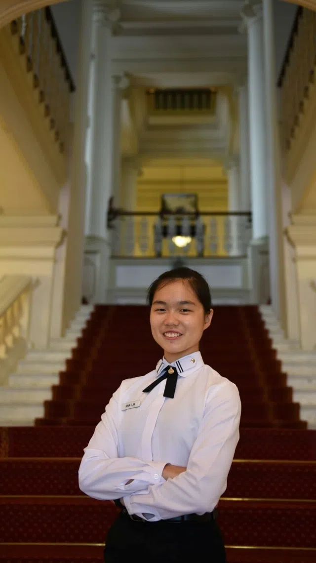 major jina lim photographed at istana after receiving the saf scholarship in 2016, one of nine recipients from the republic of singapore navy