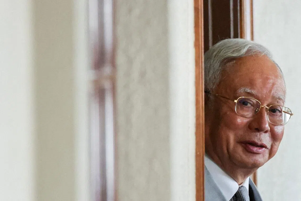 Malaysia's former Prime Minister Najib Razak, jailed for corruption in the multibillion-dollar 1MDB scandal, attends the verdict of his house arrest bid at Kuala Lumpur Courts Complex in Kuala Lumpur, Malaysia December 22, 2025. REUTERS/ Hasnoor Hussain