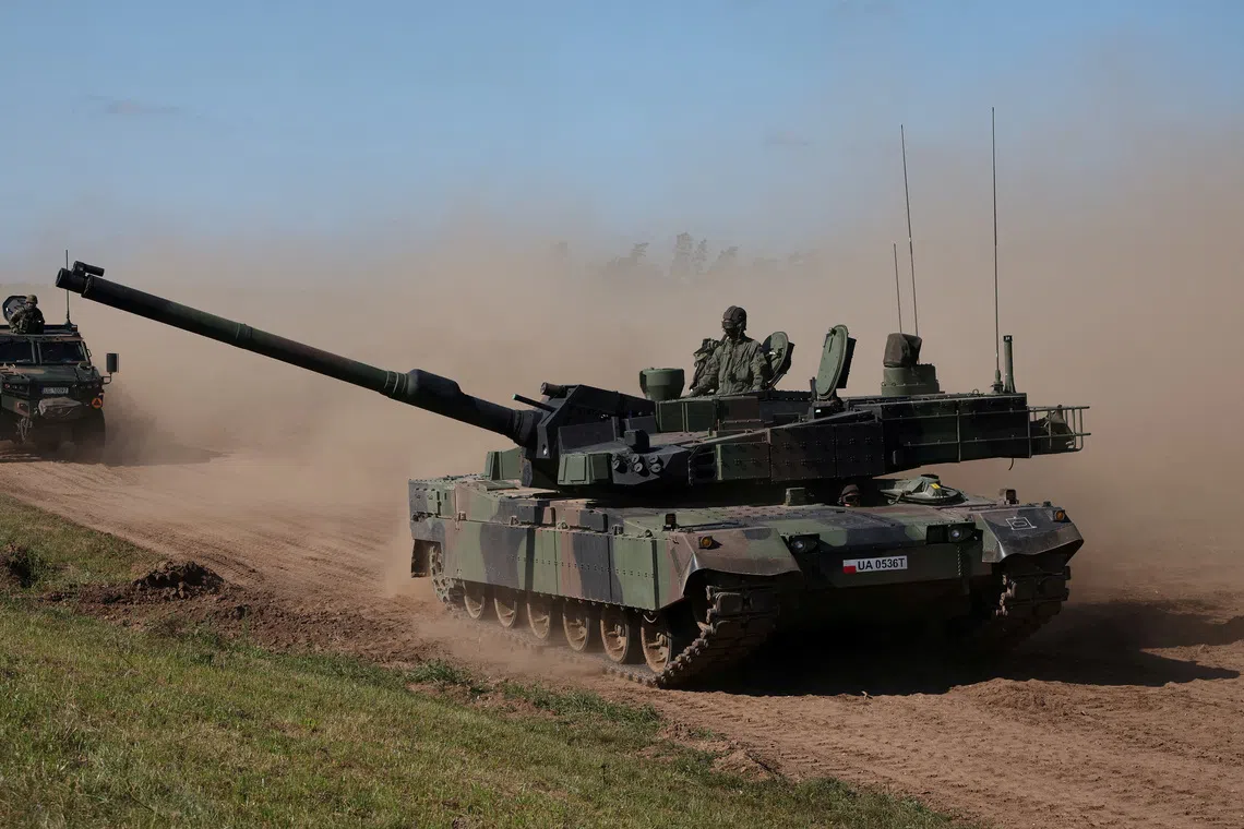 Polish soldiers riding the South Korean-made K2 Black Panther tank during trial drills near the town of Orzysz in 2023.