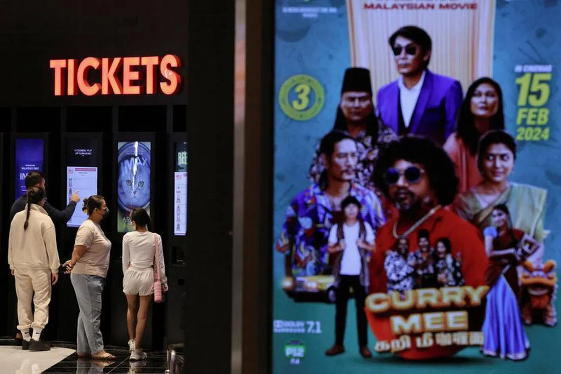 People buy movie tickets from a movie ticket kiosk at a cinema in Kuala Lumpur, Malaysia January 30, 2024. REUTERS/Hasnoor Hussain