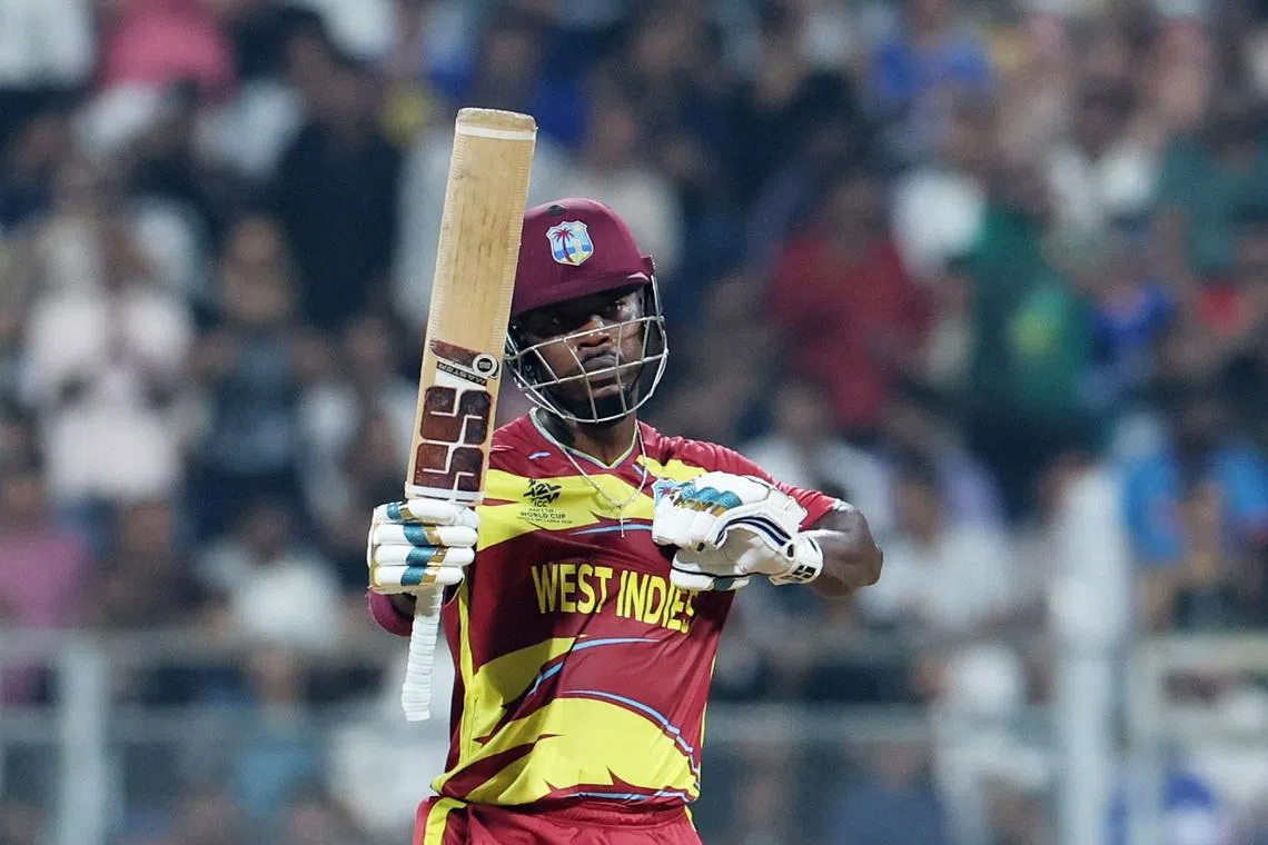 Cricket - ICC Men's T20 World Cup 2026 - Group C - England v West Indies - Wankhede Stadium, Mumbai, India - February 11, 2026 West Indies' Sherfane Rutherford celebrates after reaching his half century REUTERS/Francis Mascarenhas