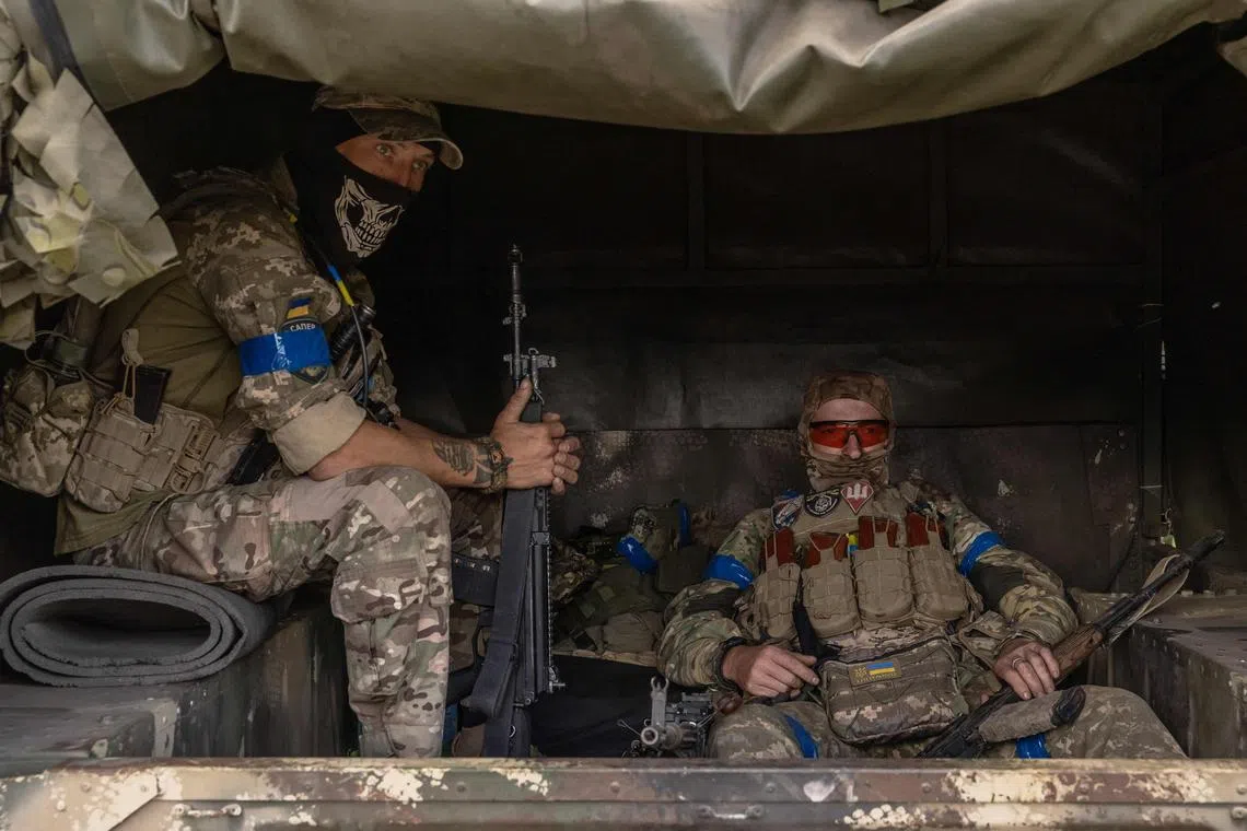 Ukrainian servicemen waiting in a military vehicle to head for a combat mission, in the Sumy region, near the border with Russia, on Aug 13.