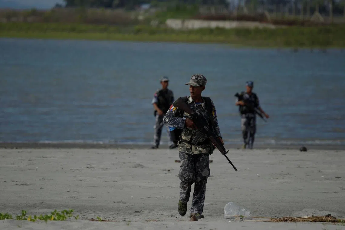 FILE PHOTO: Myanmar border guard police force patrol near the Myanmar-Bangladeshi border outside Maungdaw, northern Rakhine state, Myanmar, November 12, 2017. REUTERS/Wa Lone/File Photo