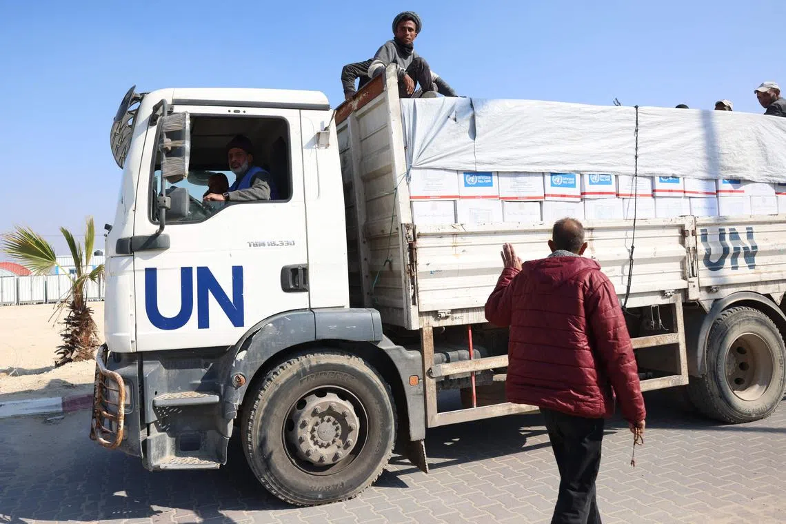 An UNRWA personnel drives a truck during a tour by UNRWA's Senior Emergency Officer of an UNRWA building in Khan Yunis on Dec 3.