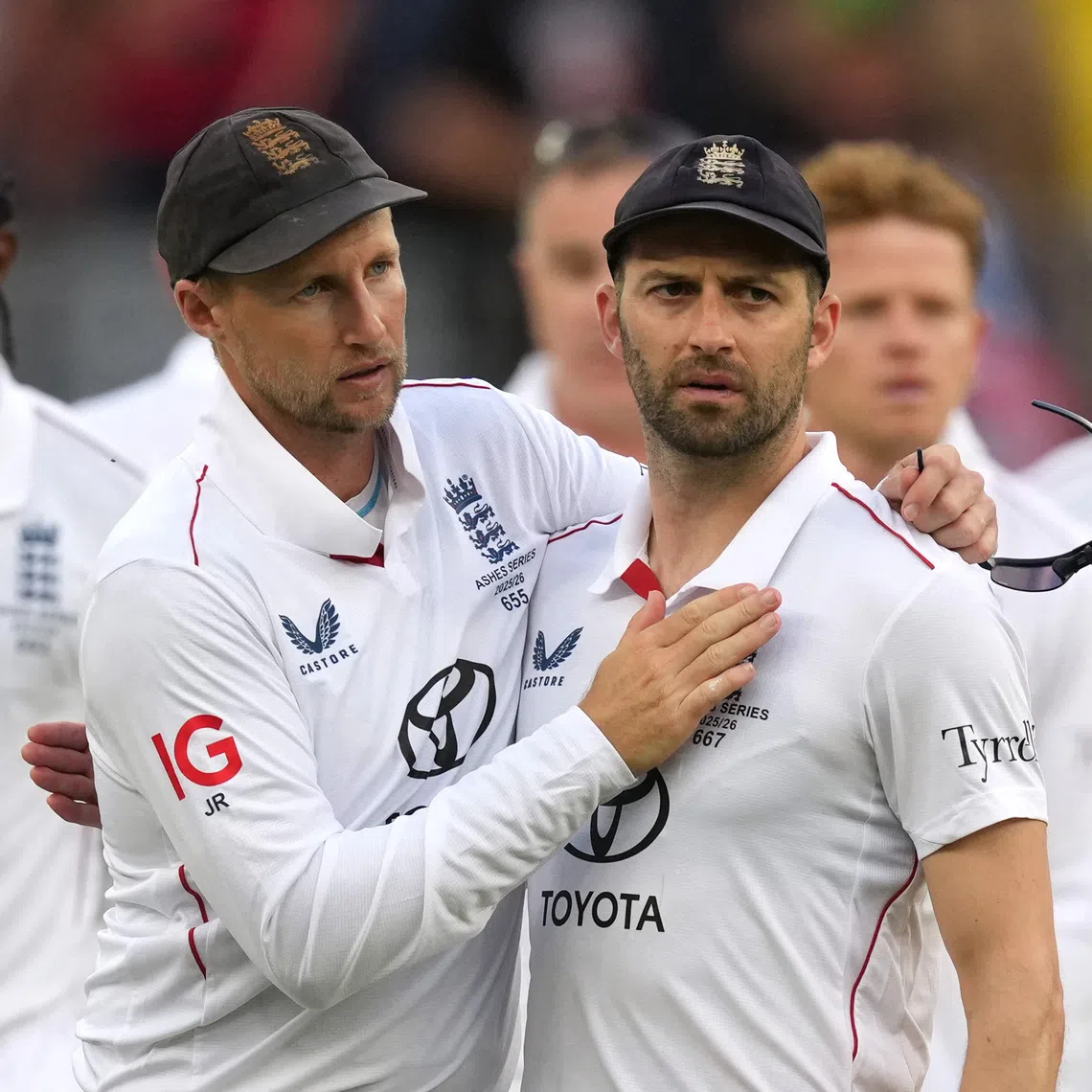 Cricket - The Ashes - Australia v England - First Test - Perth Stadium, Perth, Australia - November 22, 2025 England's Mark Wood and Joe Root look dejected after the match. REUTERS/Asanka Brendon Ratnayake