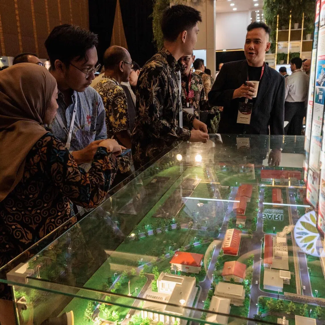 People visiting the booth of Indonesian nickel and cobalt producer Ceria during the Indonesia Critical Minerals Conference & Expo 2025 in Jakarta on June 3, 2025. 