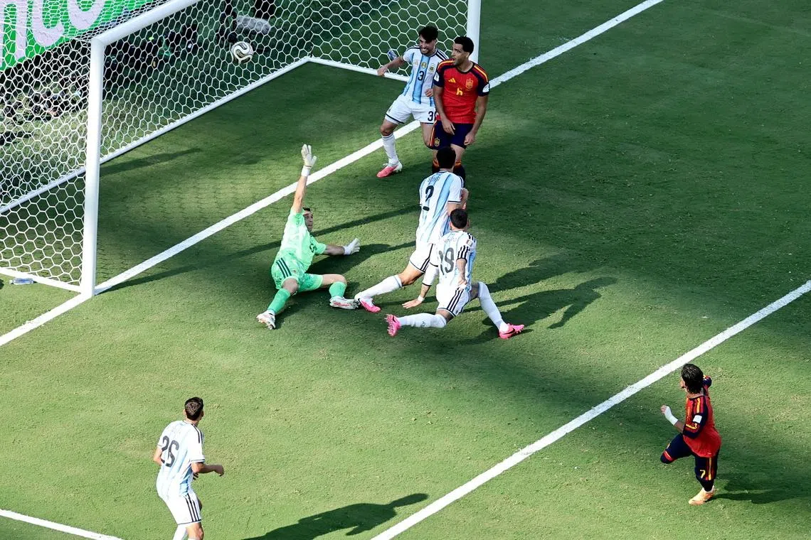 Spain’s Ferran Torres scores the winning goal against Argentina.