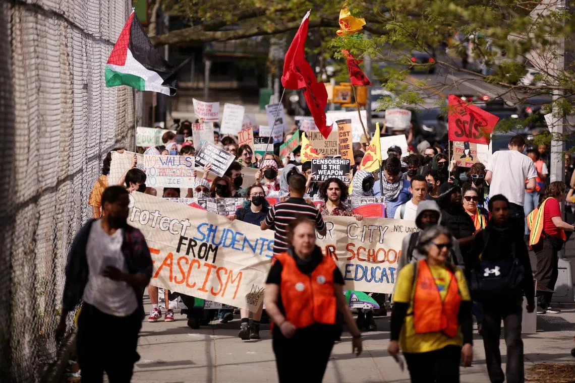 Protesters march from City College to Columbia University against the Trump administration's policies and to demand "liberty, solidarity and accountability" from their universities in New York on April 25.