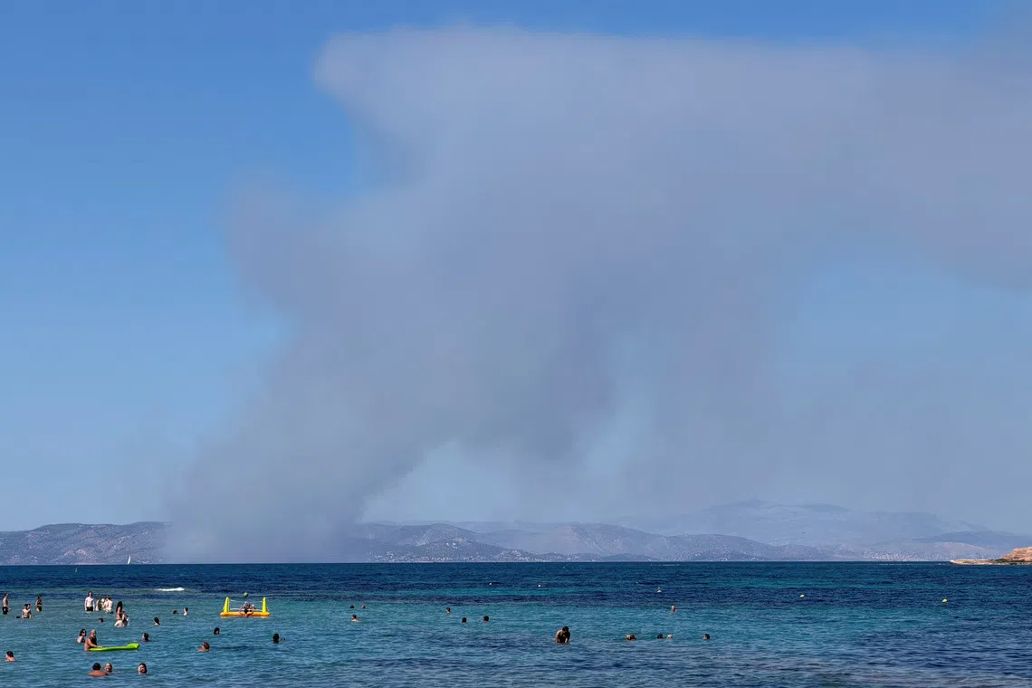 Two die as wildfires sweep Greek island of Salamina