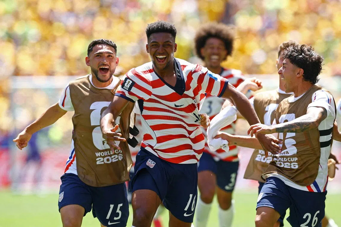 Soccer Football - FIFA World Cup 2026 - Group D - United States v Australia - Seattle Stadium, Seattle, Washington, U.S. - June 19, 2026 Alex Freeman of the U.S. celebrates scoring their second goal with Cristian Roldan and Alex Zendejas REUTERS/Albert Gea