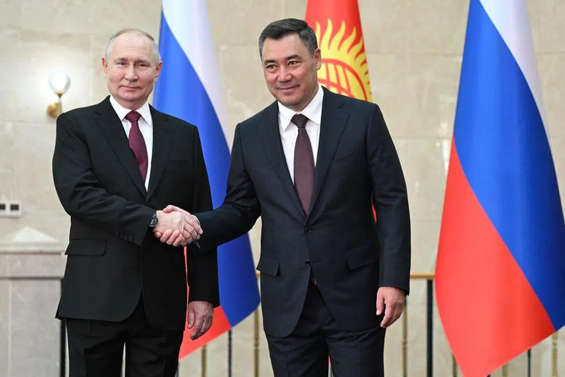 Russia's President Vladimir Putin shakes hands with Kyrgyzstan's President Sadyr Japarov during a meeting in Bishkek, Kyrgyzstan October 12, 2023. Sputnik/Dmitry Azarov/Pool via REUTERS