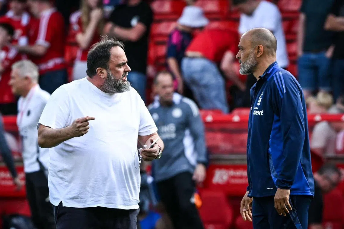 Nottingham Forest co-owner Evangelos Marinakis (left) speaking to manager Nuno Espirito Santo after Forest's drawn match against Leicester City on May 11.