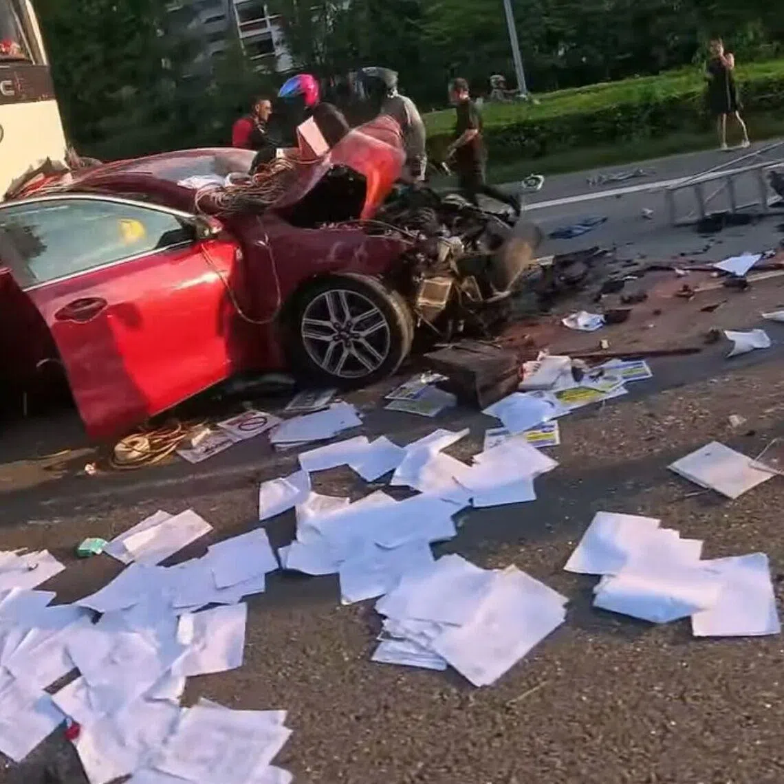 A red sedan with severely damages fronts and rears can be seen in a video of the accident.