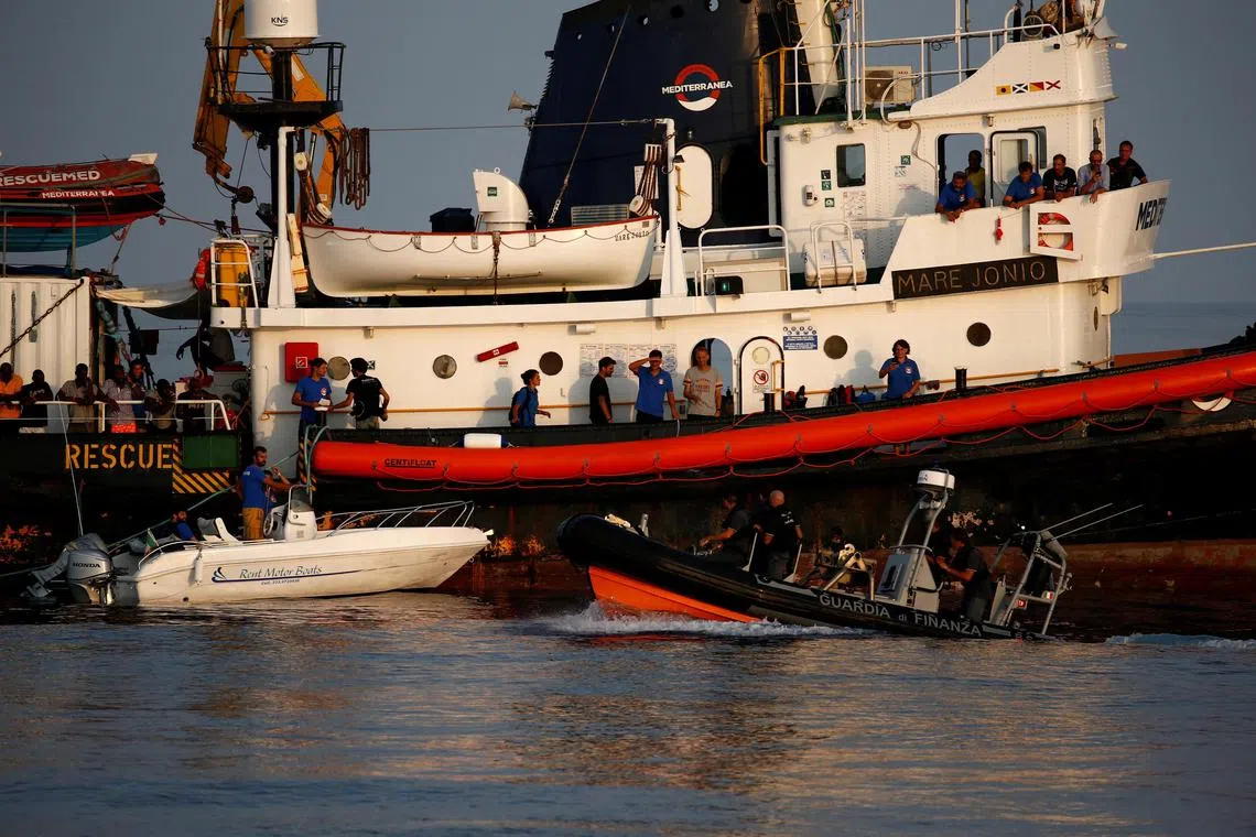 A 2019 photo shows crew members and rescued migrants on the deck of the Mare Jonio, operated by Italian charity Mediterranea Saving Humans.
