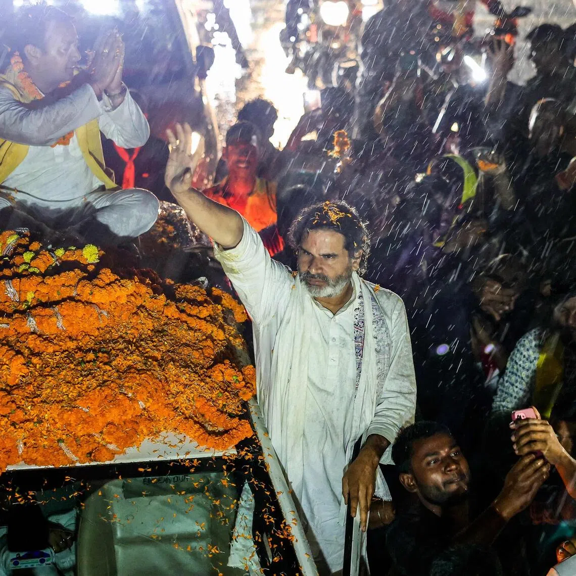 Mr Prashant Kishor, founder of the Jan Suraaj party and a former poll strategist for the BJP, waves to supporters on Oct 30, ahead of assembly elections in Bihar, India's poorest state.
