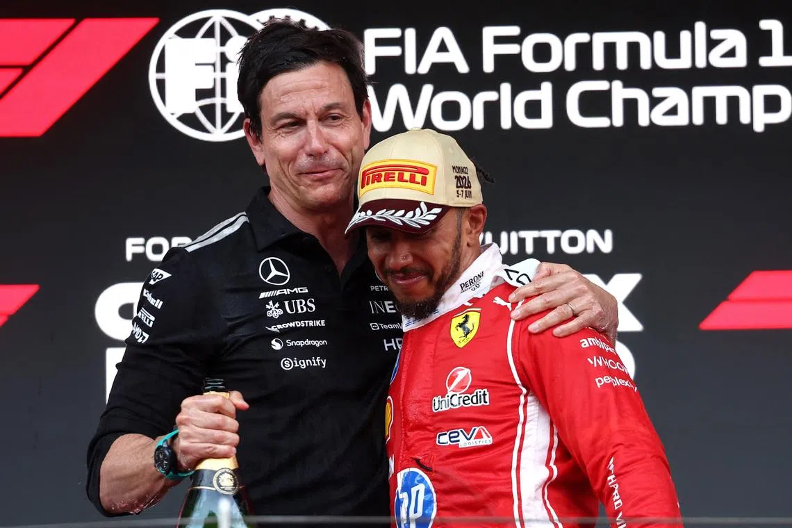 Mercedes team principal Toto Wolff (left) congratulating Ferrari's Lewis Hamilton after his second-place finish at the Monaco Grand Prix on June 7. 