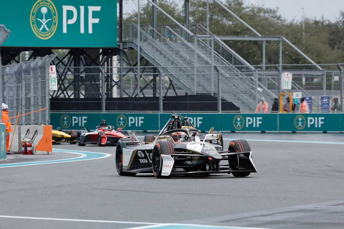 Jan 31, 2026; Miami Gardens, Florida, USA;  Jaguar Racing driver Mitch Evans (9) leads the pack into turn four during the E Prix race at Miami International Autodrome at Hard Rock Stadium. Mandatory Credit: Reinhold Matay-Imagn Images