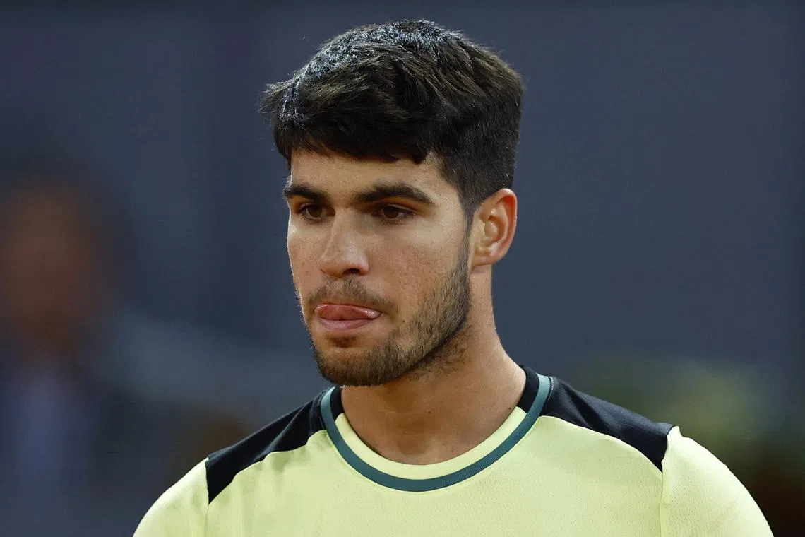 FILE PHOTO: Tennis - Madrid Open - Park Manzanares, Madrid, Spain - May 1, 2024  Spain's Carlos Alcaraz reacts during his quarter final match against Russia's Andrey Rublev REUTERS/Susana Vera
