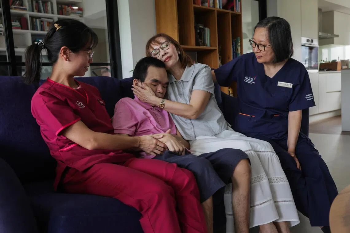 Star PALS (Paediatric Advanced Life Support) associate consultant Kang Zhi Lin visiting Matthew and his mother at home. Denise Goh, who diagnosed Matthew with Sanfilippo syndrome, continues to oversee his care.