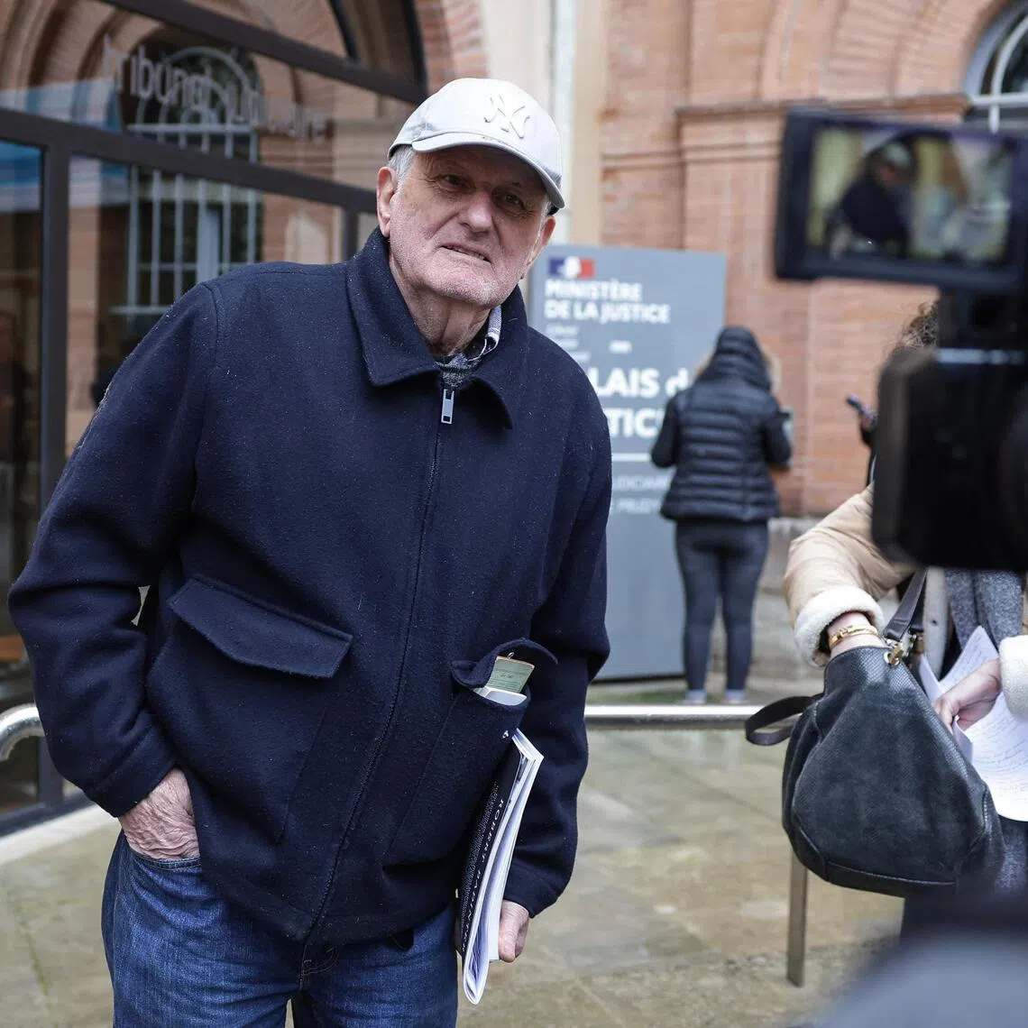 Jean-Paul answering media questions ahead of his trial, in Montauban, southwestern France, on Jan 9.