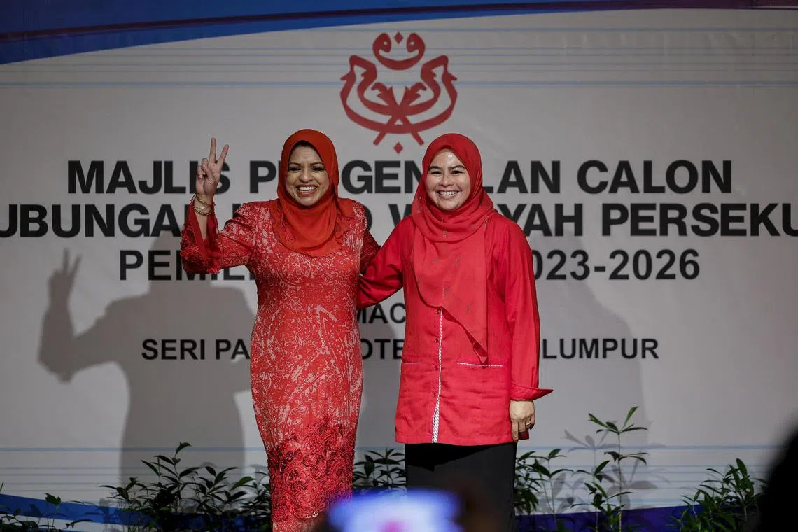 Incumbent Women’s wing leader Noraini Ahmad (right) retained her leadership of the wing, despite a stiff challenge from her predecessor Shahrizat Abdul Jalil.