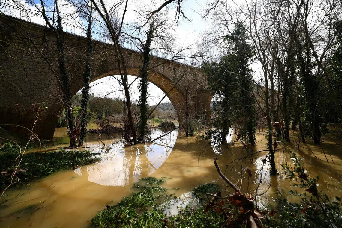 A pair of children were among those missing after being caught in floods while trying to cross a bridge over bursting waters of the river Gardon. 