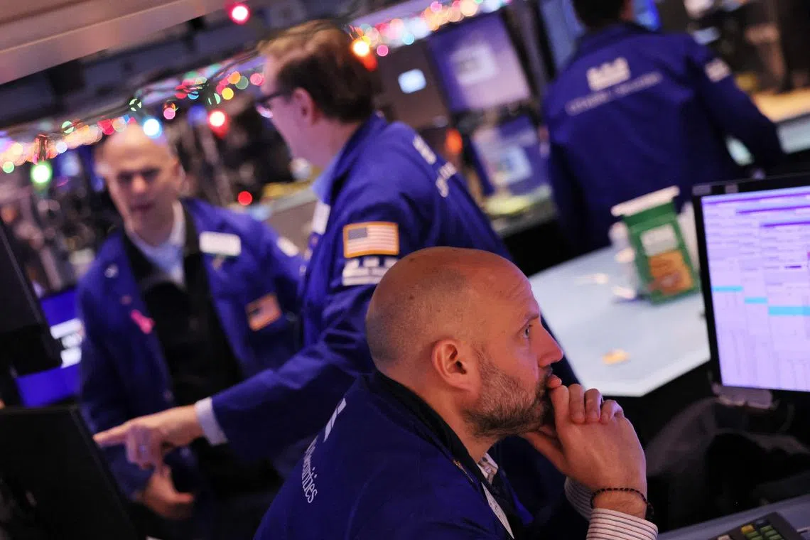 Traders work on the floor of the New York Stock Exchange.