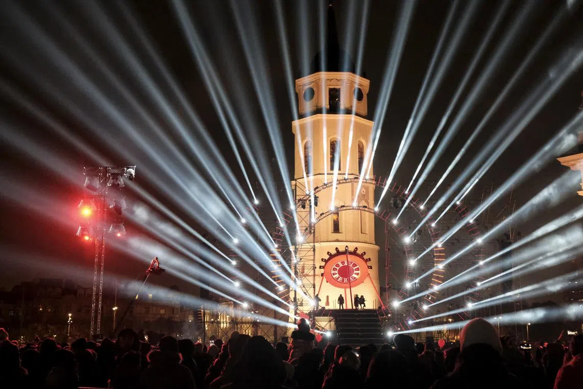 People watch a musical and visual journey titled 'Time Portal' during the Vilnius 700th anniversary celebration, in Vilnius, Lithuania, Jan 25, 2023.  