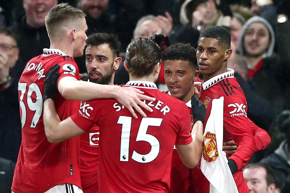 Marcus Rashford (right) celebrates with teammates, after scoring for Manchester United.