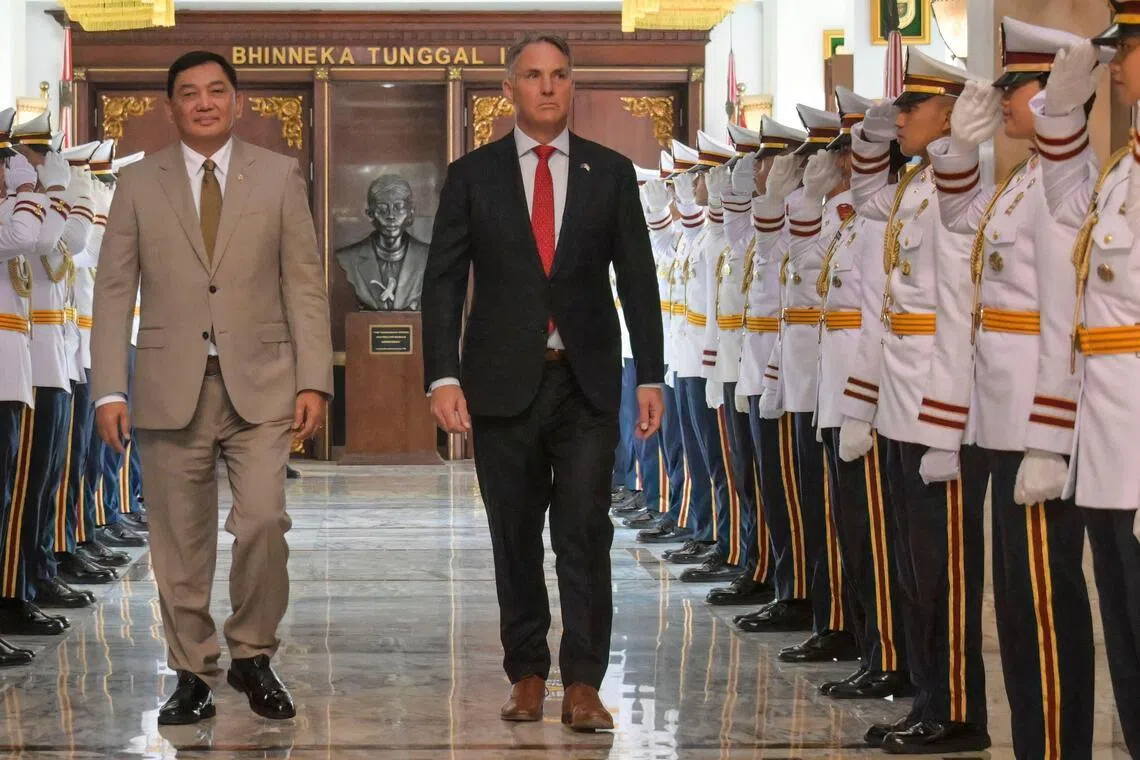 Australia's Defence Minister Richard Marles (R) walks with his Indonesian counterpart, Mr Sjafrie Sjamsoeddin, after their meeting at the defence ministry in Jakarta on March 12, 2026. 
