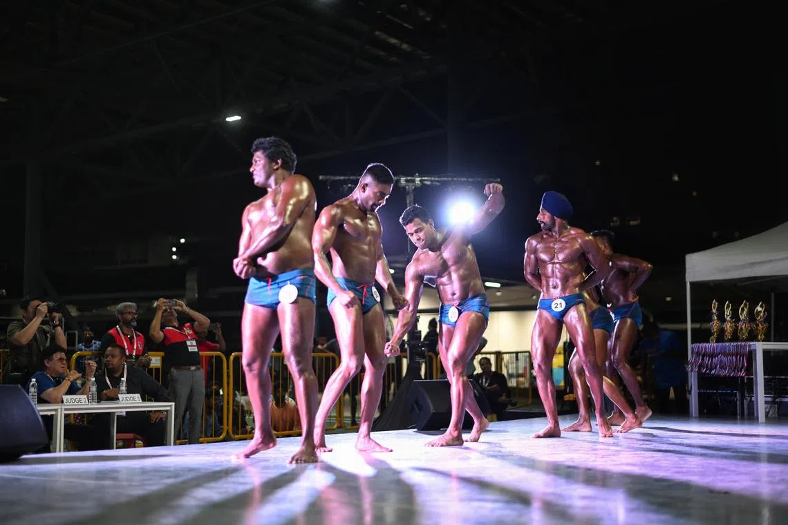 Bodybuilding participants on stage during the Migrant Workers' Centre Bodybuilding Championship at Migrant Workers' Centre Recreation Club on Feb 26, 2023.