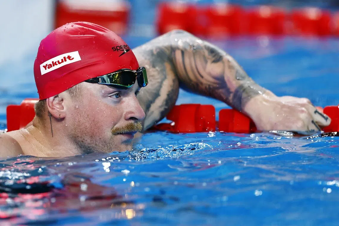 FILE PHOTO: Swimming - World Aquatics Championships - Aspire Dome, Doha, Qatar - February 13, 2024 Britain's Adam Peaty reacts after the men's 50m breaststroke semifinal 1 REUTERS/Clodagh Kilcoyne