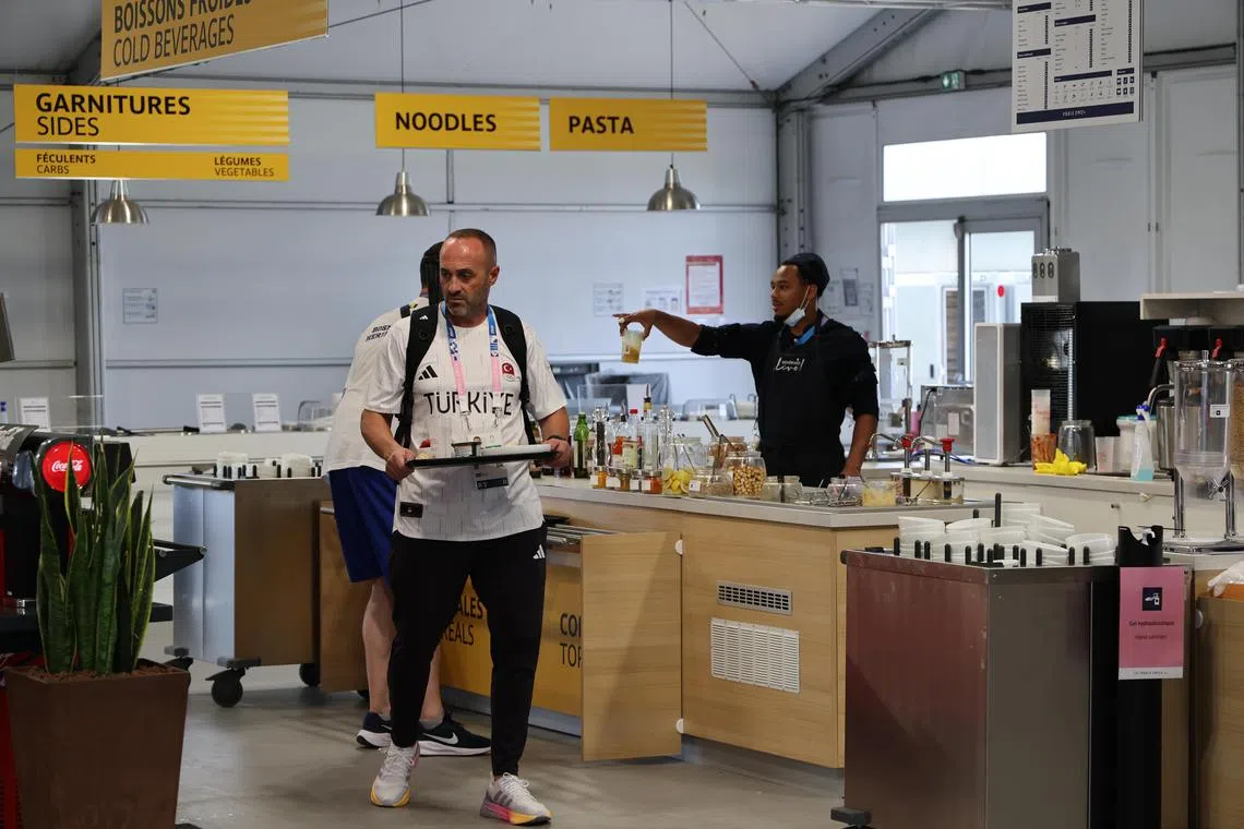 Views of the dining hall inside the Olympic Village at St Denis