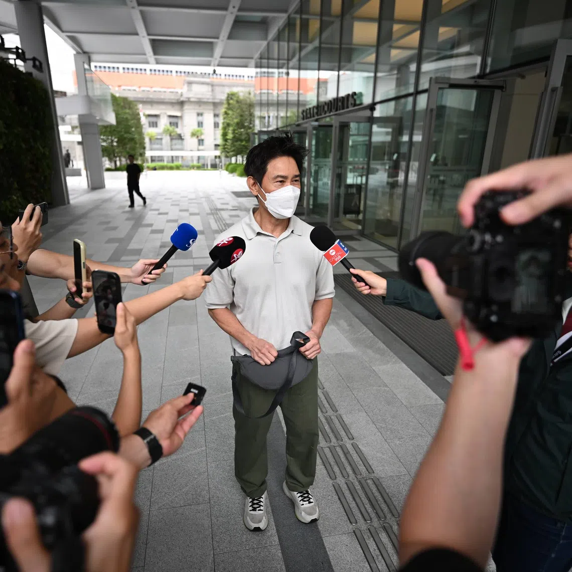 Edmund Chen leaving State Courts Towers after speaking to the media on Mar 4.