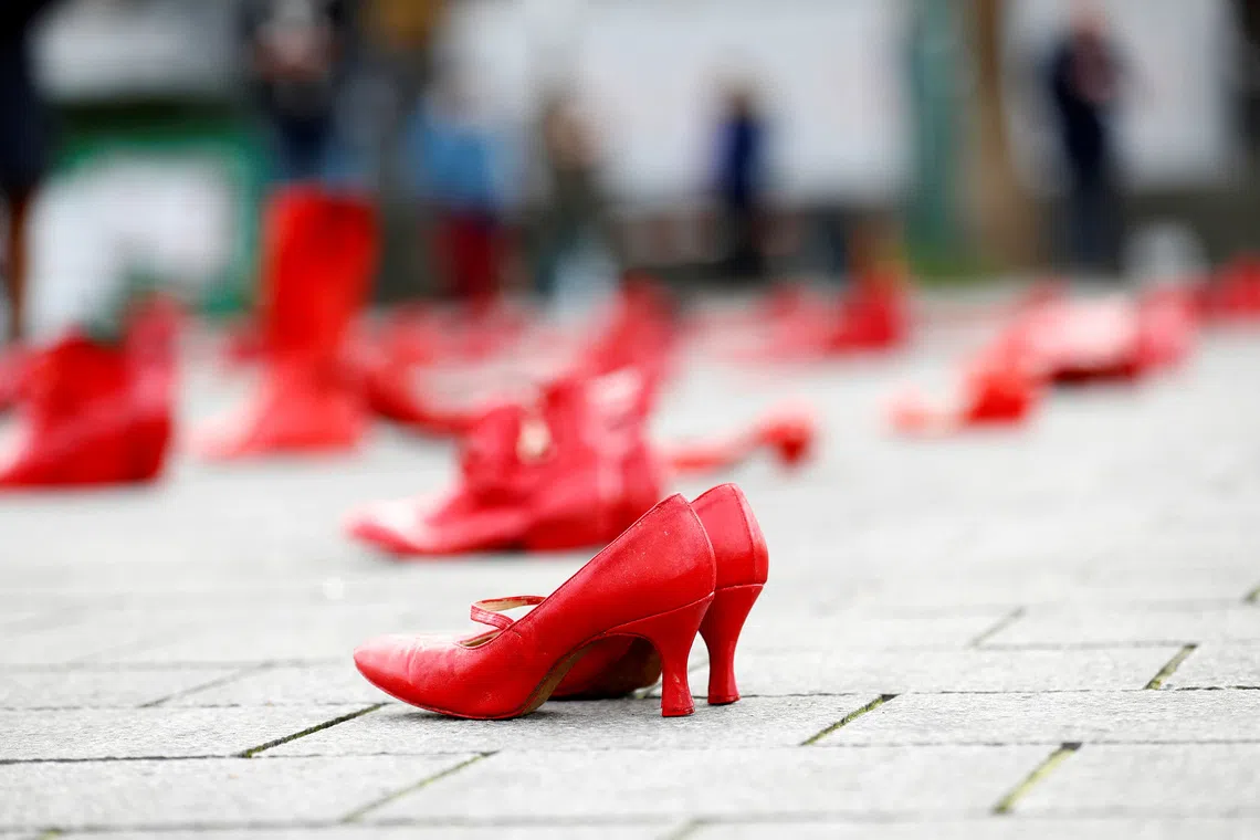 FILE PHOTO: Red shoes are placed on the ground during a demonstration against all kinds of violence towards women in central Brussels, Belgium November 24, 2019. REUTERS/Francois Lenoir/File Photo