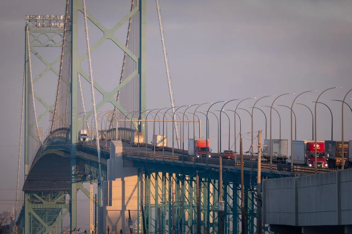 Trucks crossing the Ambassador Bridge between Detroit and Windsor, Ontario, Canada. The US House voted to rescind tariffs President Donald Trump imposed on Canada last year.