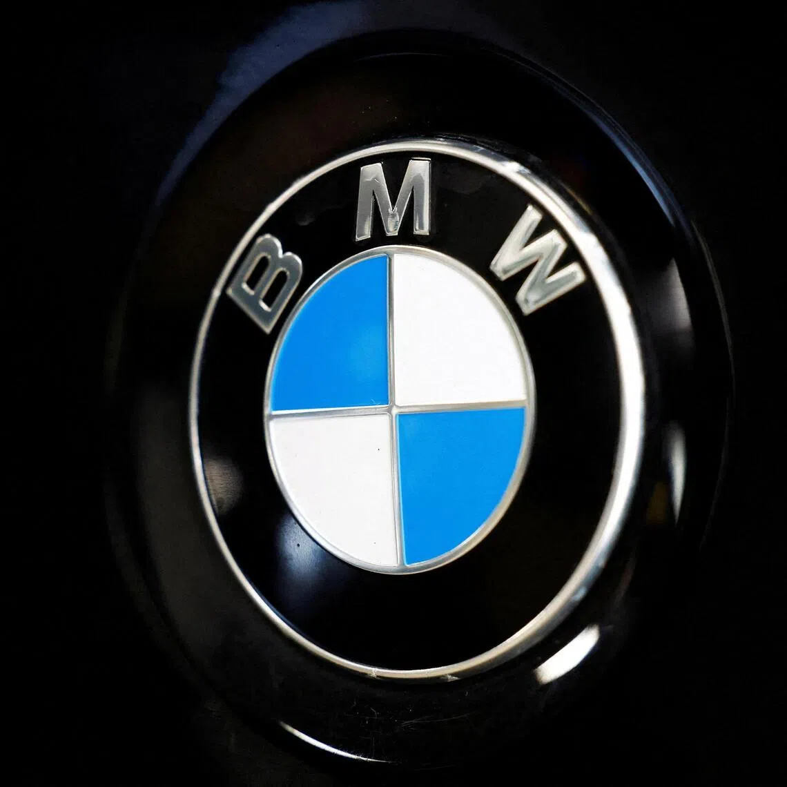FILE PHOTO: A logo of BMW is seen inside a car dealer in Nijmegen, Netherlands February 26, 2025. REUTERS/Piroschka van de Wouw/File Photo