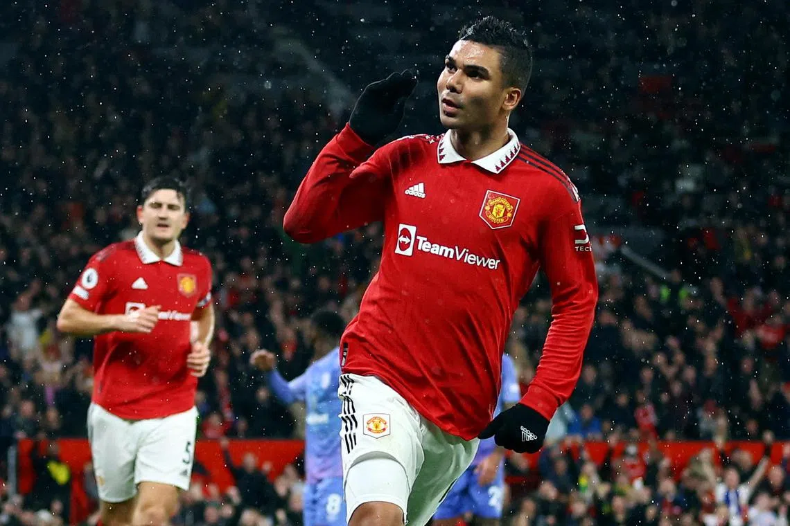 Manchester United's Casemiro celebrates scoring their first goal.