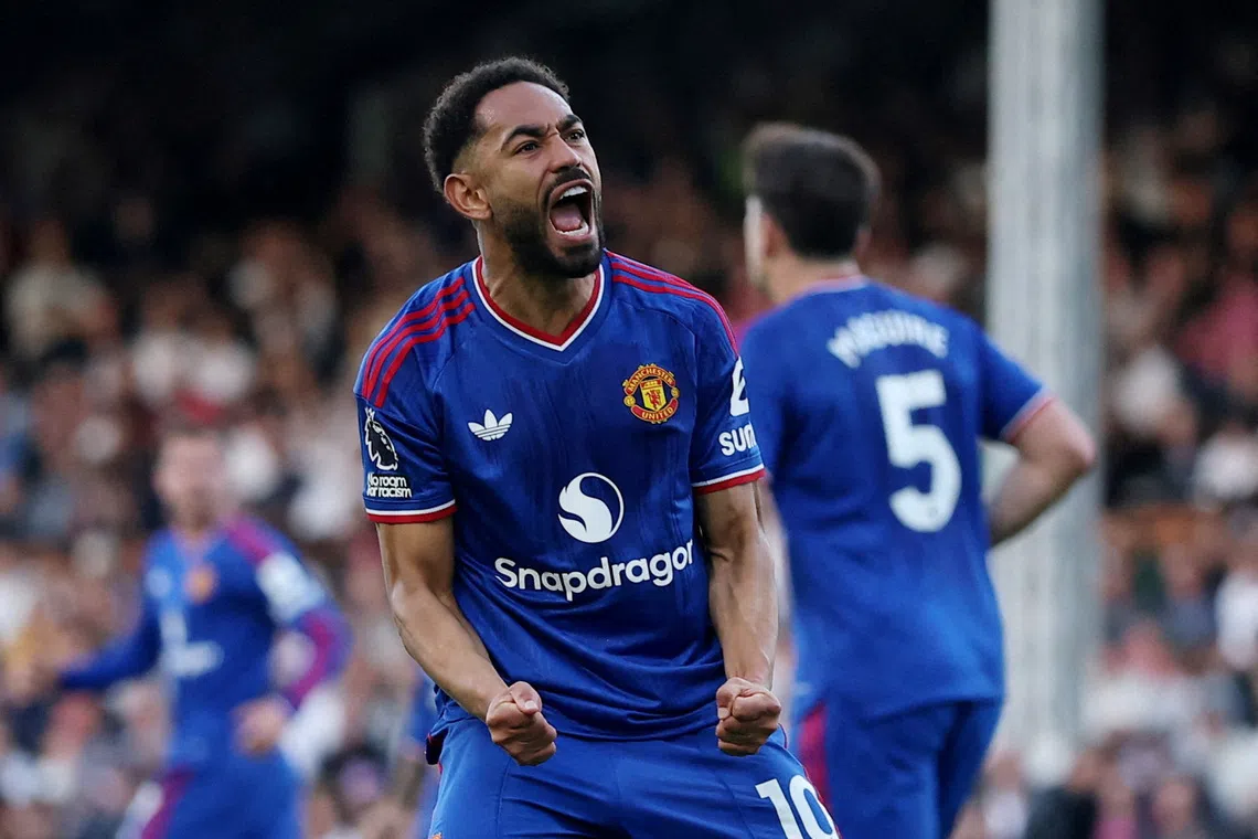 Manchester United’s Matheus Cunha celebrates scoring their first goal against Fulham.