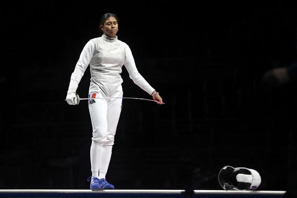 FILE PHOTO: FILE PHOTO: Tokyo 202 0 Olympics - Fencing - Women's Team Foil - Gold medal match - Makuhari Messe Hall B - Chiba, Japan - July 29, 2021. Ysaora Thibus of France reacts REUTERS/Carl Recine/File Photo