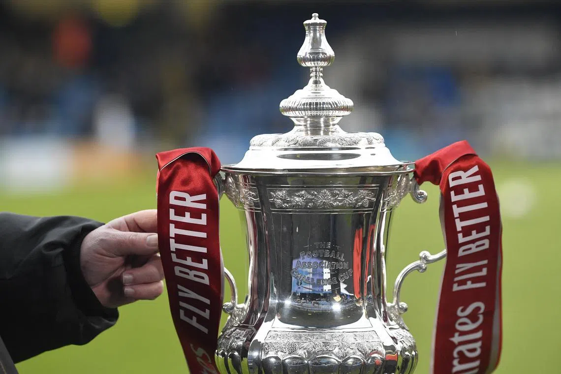 The FA Cup trophy on display before a third round match between Gillingham and Leicester City on Jan 7.