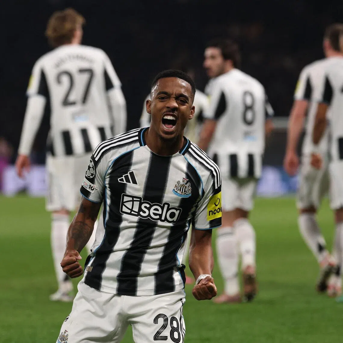 Newcastle United's Joe Willock celebrates scoring the 1-1 equaliser against Paris Saint-Germain.