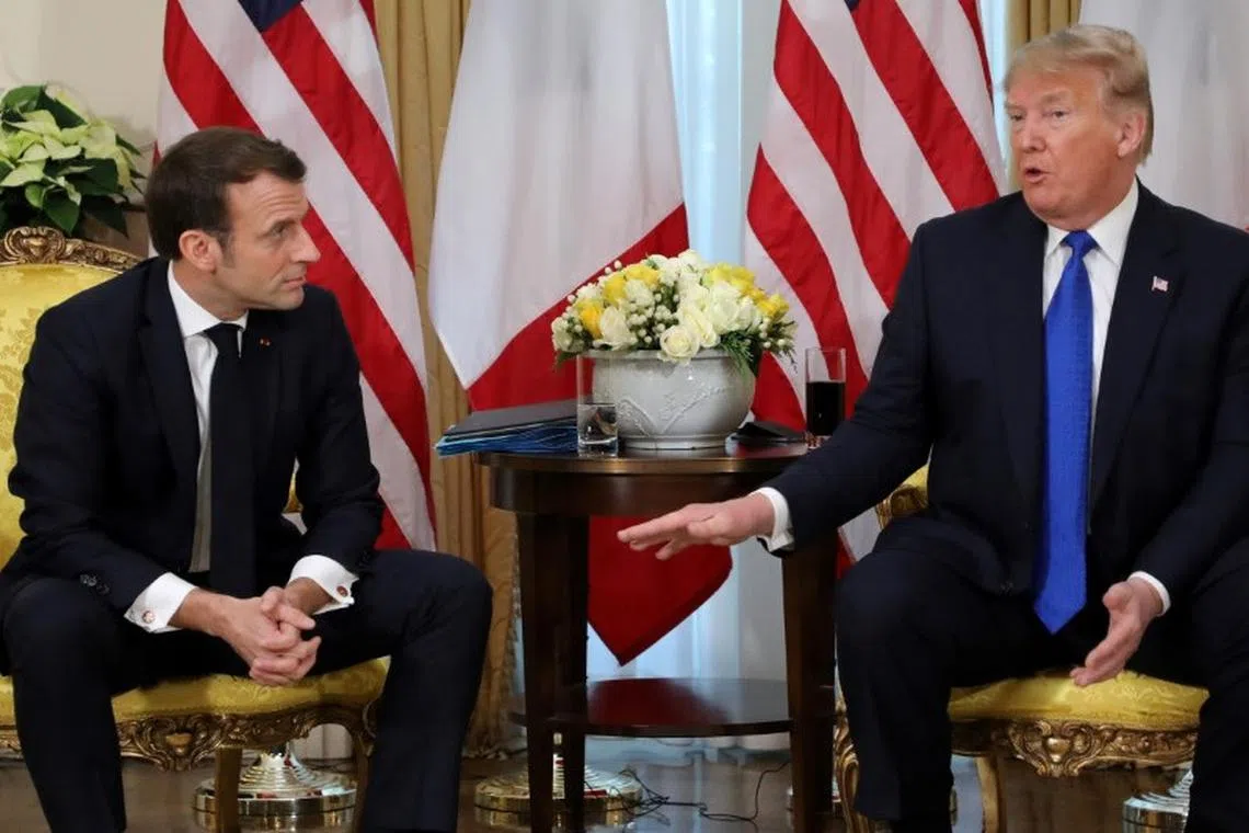 U.S. President Donald Trump gestures during the meeting with France's President Emmanuel Macron, ahead of the NATO summit in Watford, in London, Britain, December 3, 2019. Ludovic Marin/Pool via REUTERS/File Photo