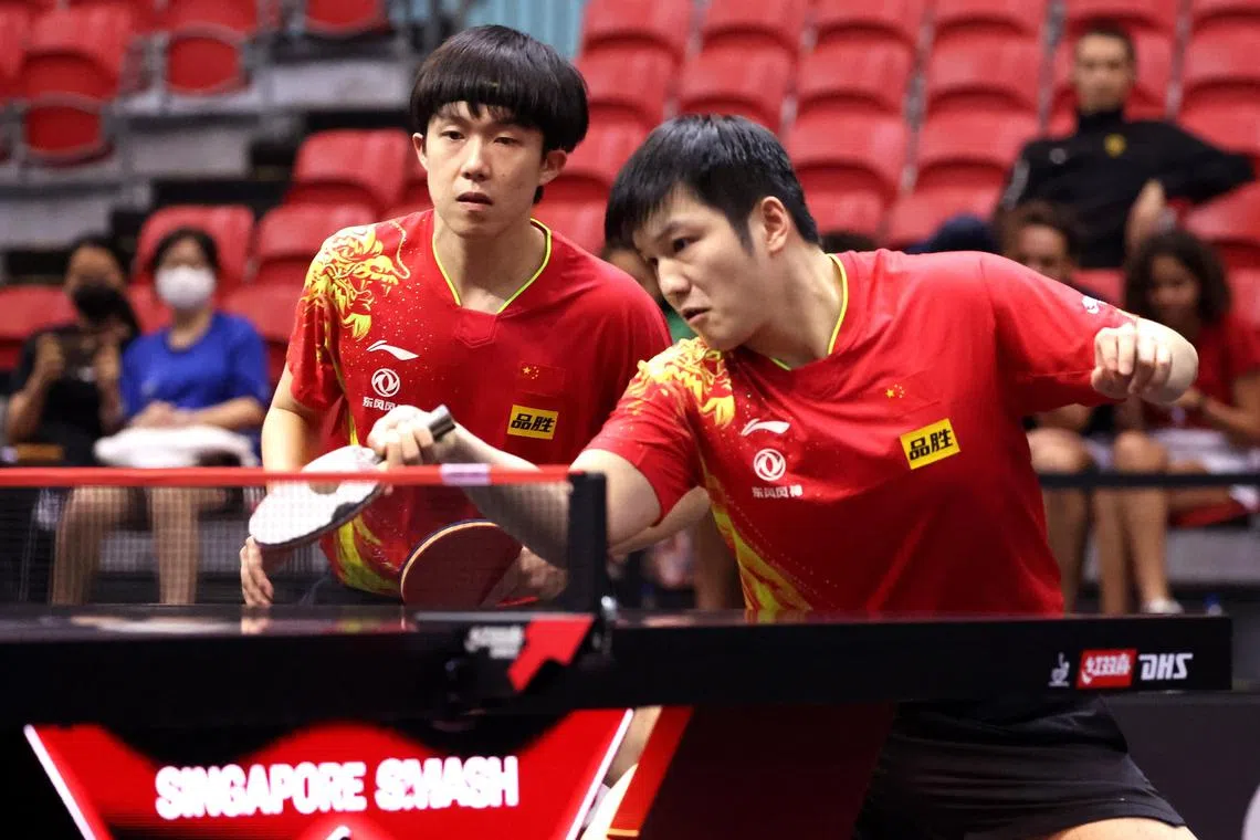 Fan Zhendong (right) and Wang Chuqin of China in action against Japan's Yukiya Uda and Shunsuke Togami  during the men's doubles semi-final at the Singapore Smash. The Chinese won 3-1. 