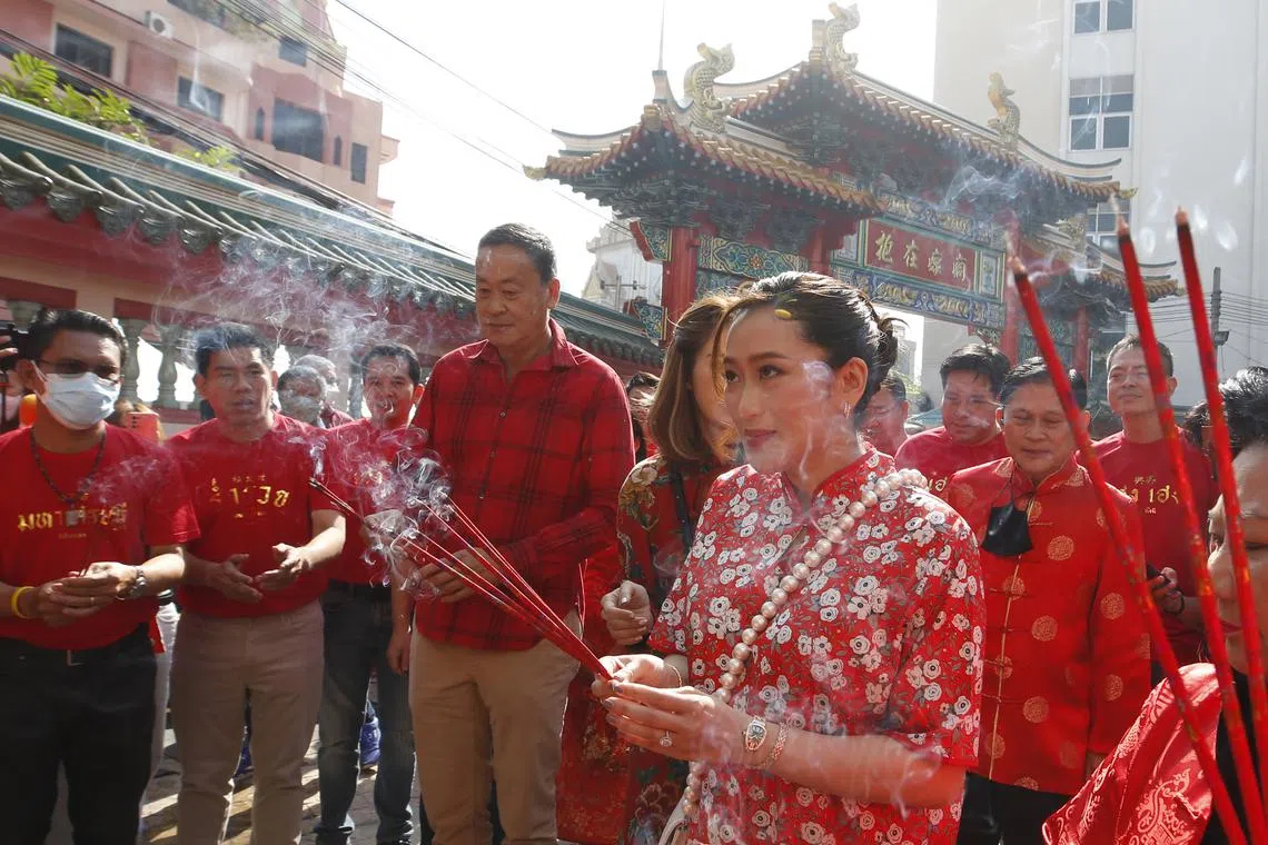 Pheu Thai Party leader Paetongtarn Shinawatra (right) during a visit to a community in Chinatown, Bangkok, Thailand, on Jan 21.