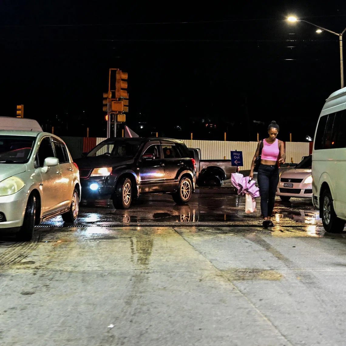 Car line up at a gas station before hurricane Beryl lands in Bridgetown, Barbados on June 29, 2024. Much of the southeast Caribbean was on alert June 29, 2024 as Beryl strengthened into the first hurricane of the 2024 Atlantic season, with forecasters warning it will swiftly become a major storm. (Photo by CHANDAN KHANNA / AFP)