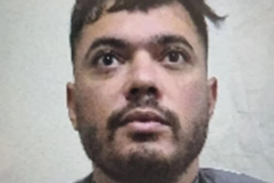 Undated mugshot of 30-year-old French inmate Mohamed Amra, also known as \"The Fly\", who was freed by accomplices in a May 14, 2024 deadly French prison van attack that left two guards dead and three injured. Handout via REUTERS