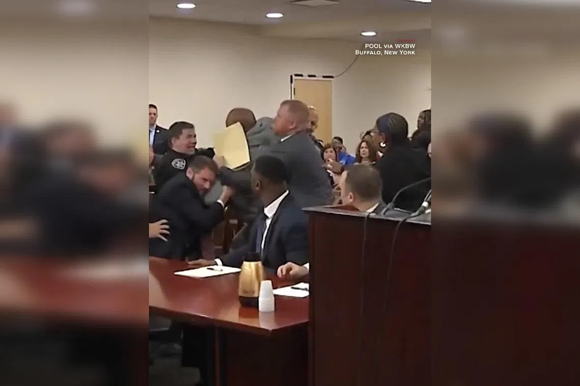 A man was restrained by security guards, after rushing at Payton Gendron during emotional statements by the relatives of Gendron's victims.